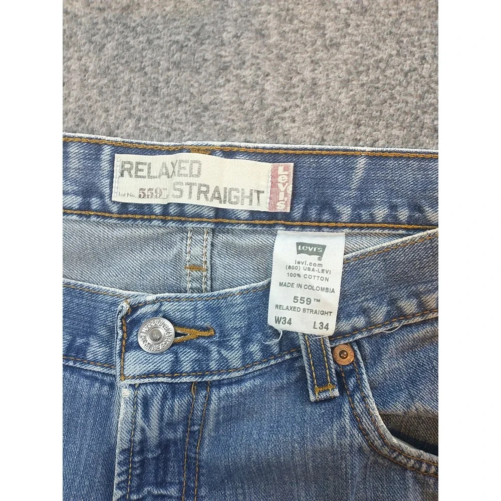 Levis 559 Relaxed Straight Jeans Mens 34x33 Light Wash Distressed Blue Denim